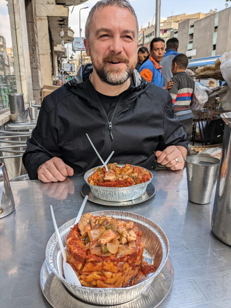 Kevin eating local food 8 Easy Ways to Avoid Getting Scammed and Prevent Tourist Traps: The Egypt Edition Happy Irish Wanderers)