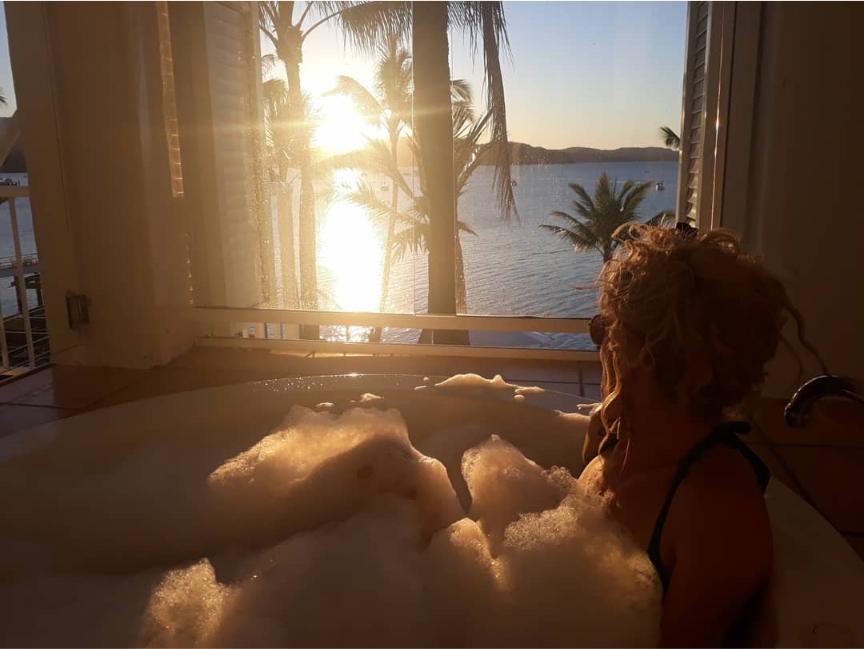 Kate in a hot tub over looking the coral sea Coral Sea Marina resort Airlie Beach Accommodation - The Best  Choices For All Budgets Happy Irish Wanderers