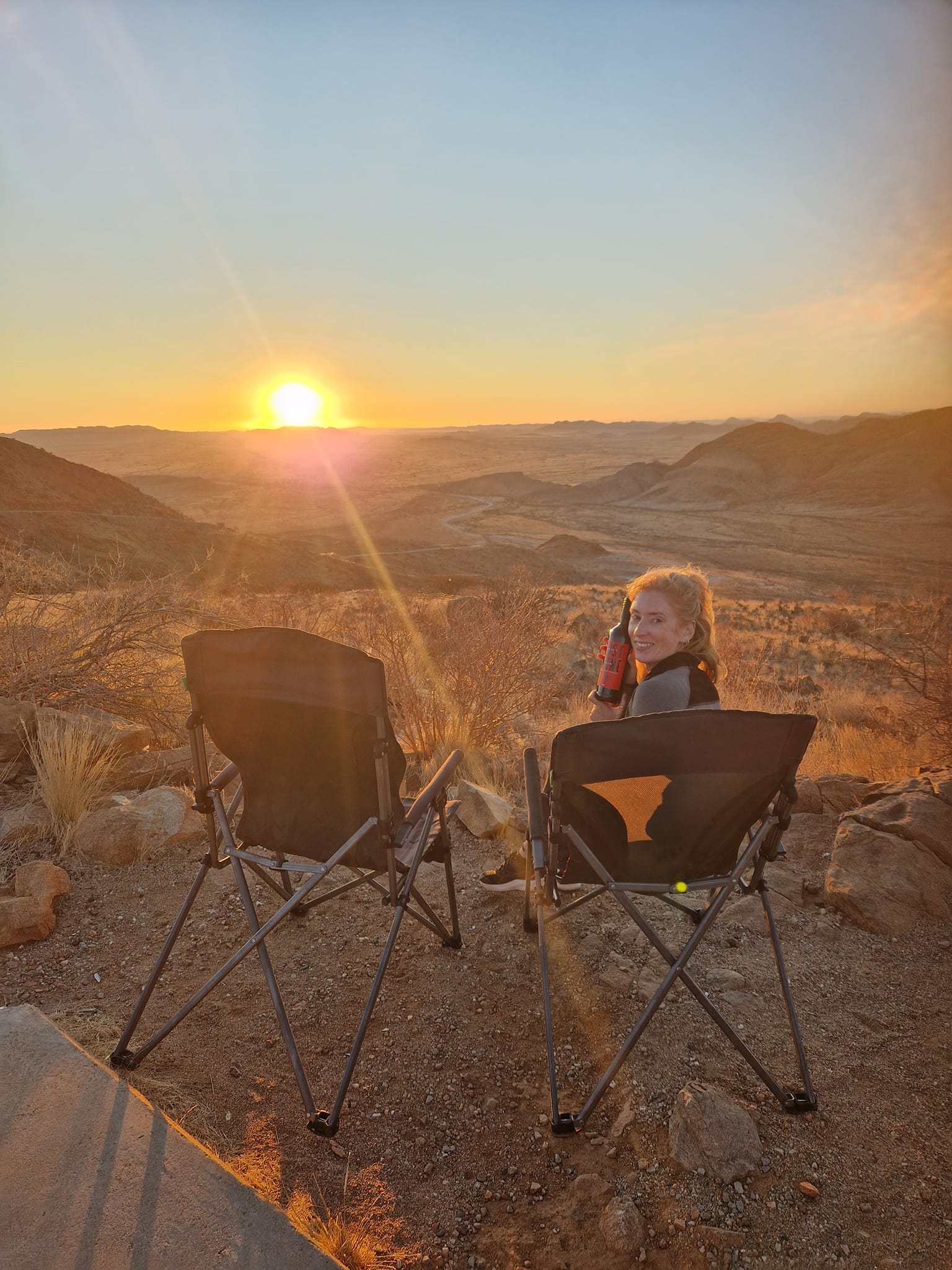 Kate from happy Irish Wanderers watching sunset in Spitzkoppe in Namibia