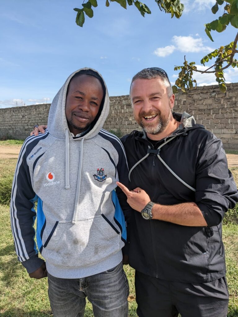 Kevin with locals in Nairobi Kenya itinerary Happy Irish Wanderers