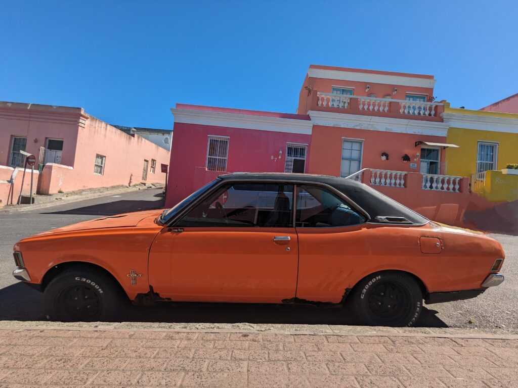 Bo Kaap in Cape Town retro orange car - Happy Irish Wanderers