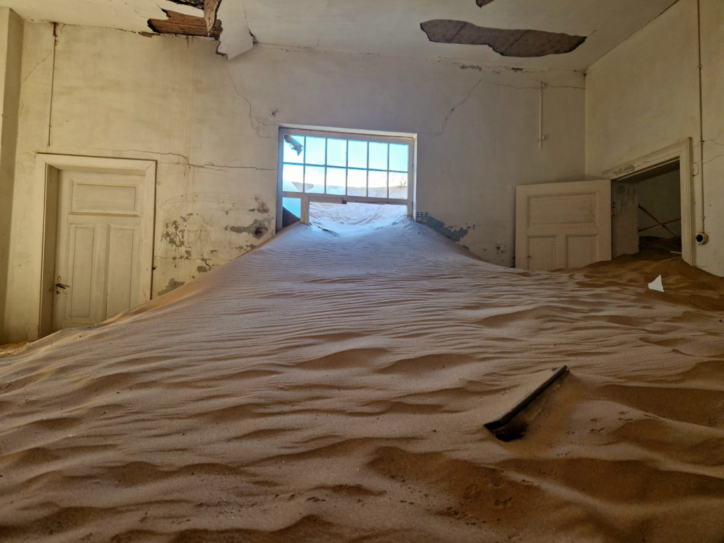 Kolmanskop Namibia Inside an abandoned building - Happy Irish Wanderers