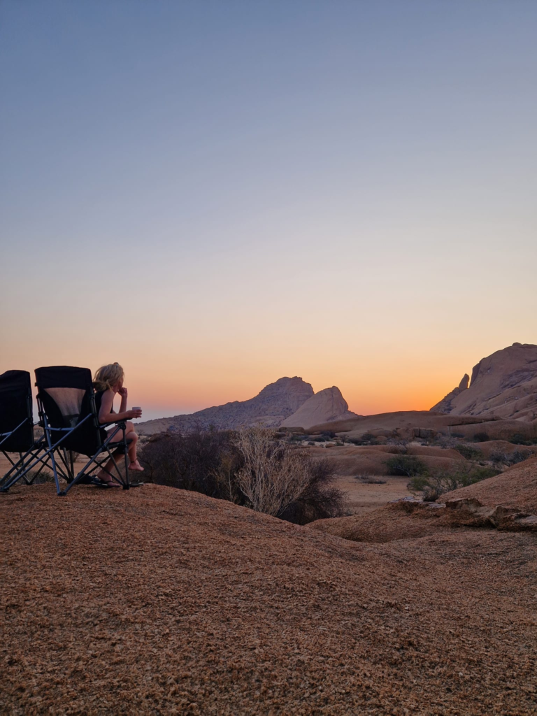 Kate from happy Irish Wanderers watching sun set in Spitzkoppe Namibia