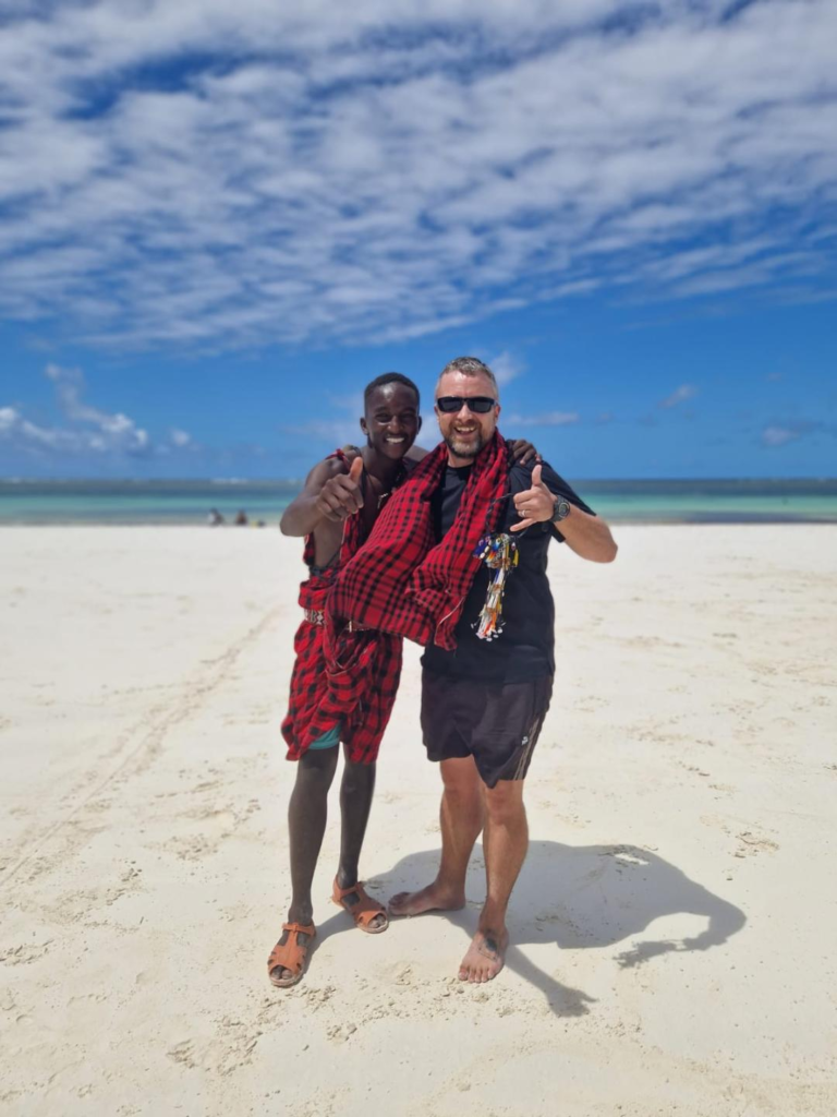 Kevin and Maasai local in Diani Beach10 Best And Most Popular To Visit Kenya Attractions - Happy Irish Wanderers