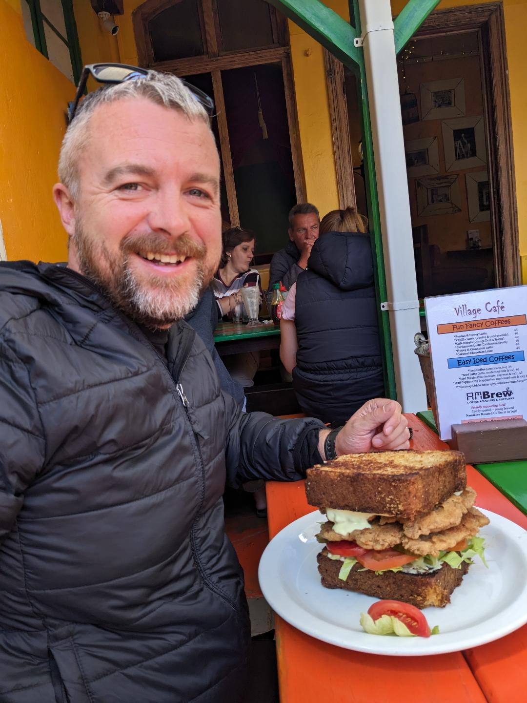 Swakopmund, Kevin from happy Irish Wanderers eating traditional "German food"