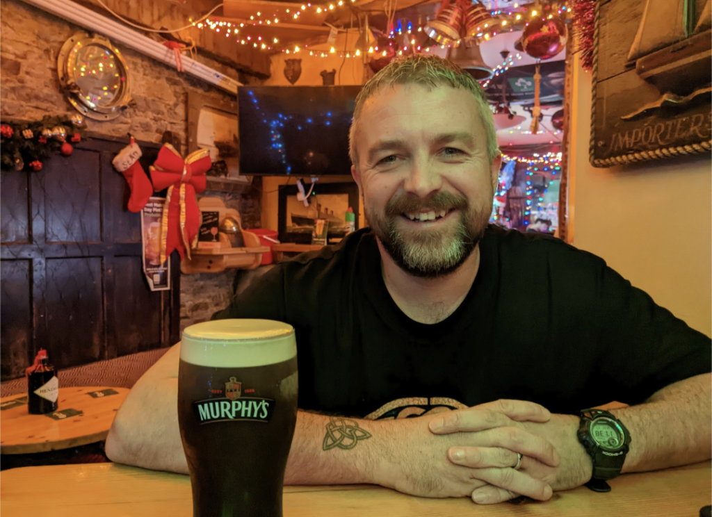 Kevin drinking a Pint of Stout in County Cork Mizen Head - Visit Ireland's Most Southerly Tip Now Happy Irish Wanderers