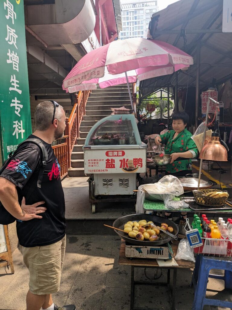 Kevin-eating-street-food-on-our-China-trip-Happy-Irish-Wanderers